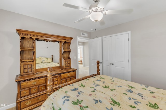 bedroom featuring ceiling fan, visible vents, and a closet