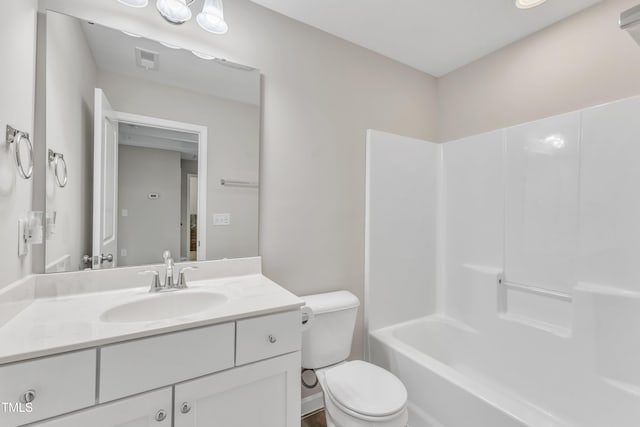 full bath with toilet, vanity, and visible vents