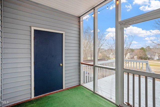 unfurnished sunroom featuring a wealth of natural light