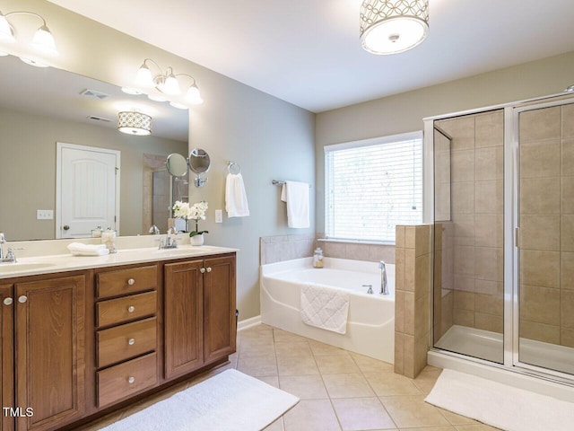 full bath featuring visible vents, a garden tub, a stall shower, a sink, and tile patterned flooring