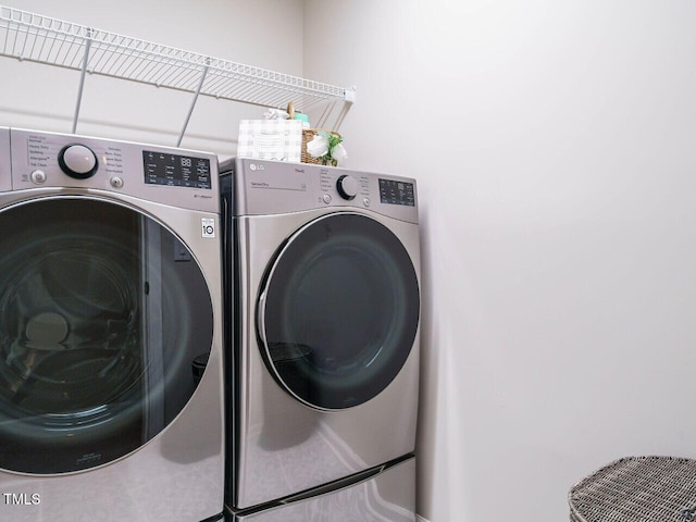 laundry room featuring laundry area and washer and clothes dryer