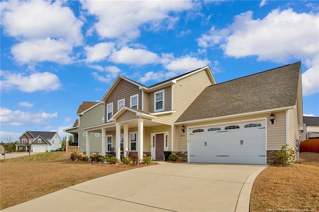 craftsman inspired home featuring a porch, an attached garage, driveway, stone siding, and a front yard