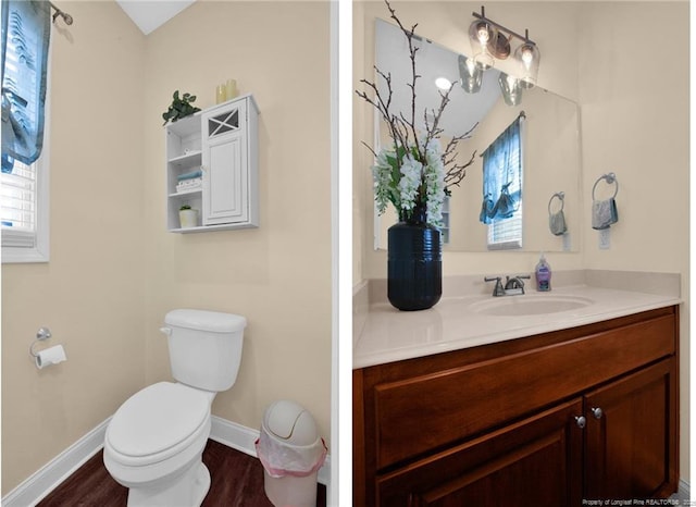 bathroom with baseboards, vanity, toilet, and wood finished floors