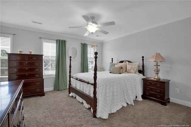 bedroom featuring multiple windows, visible vents, carpet flooring, and ornamental molding