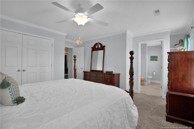 carpeted bedroom with baseboards, visible vents, ceiling fan, crown molding, and a closet