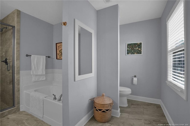 bathroom featuring toilet, a stall shower, a bath, and baseboards