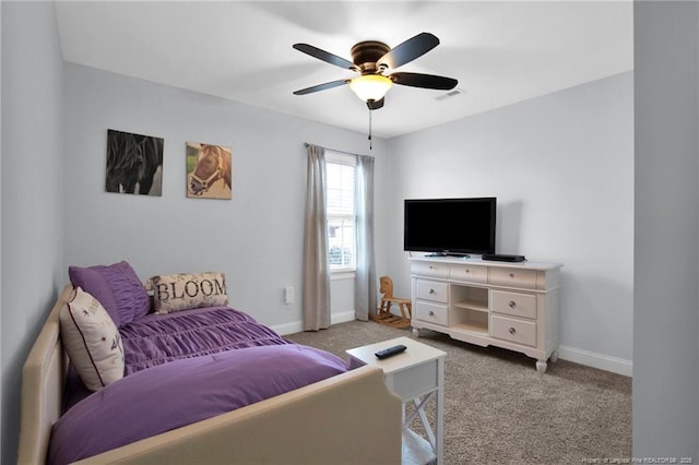 interior space with carpet floors, baseboards, visible vents, and ceiling fan