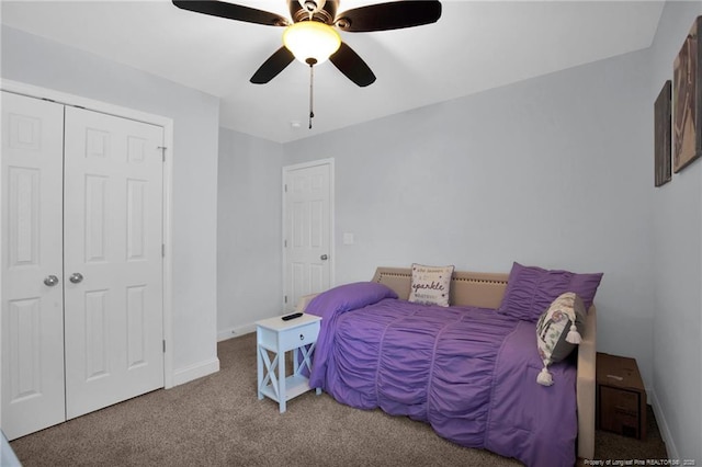 bedroom with a closet, carpet flooring, ceiling fan, and baseboards