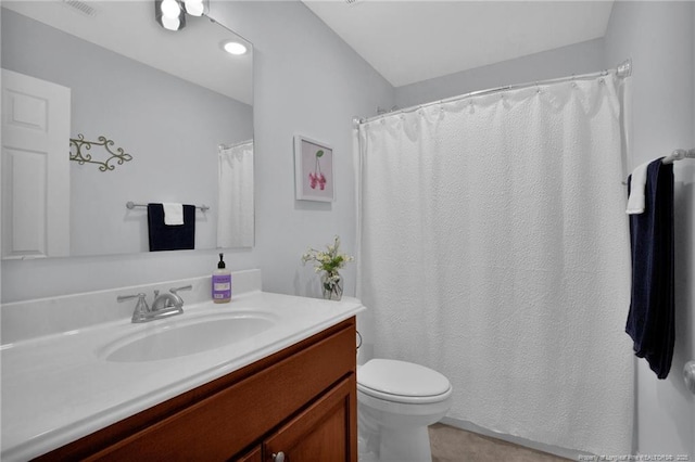 bathroom featuring visible vents, vanity, and toilet