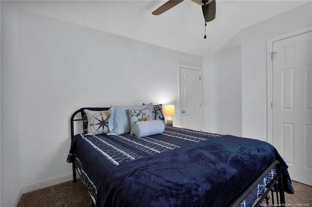 bedroom with ceiling fan, baseboards, and carpet flooring