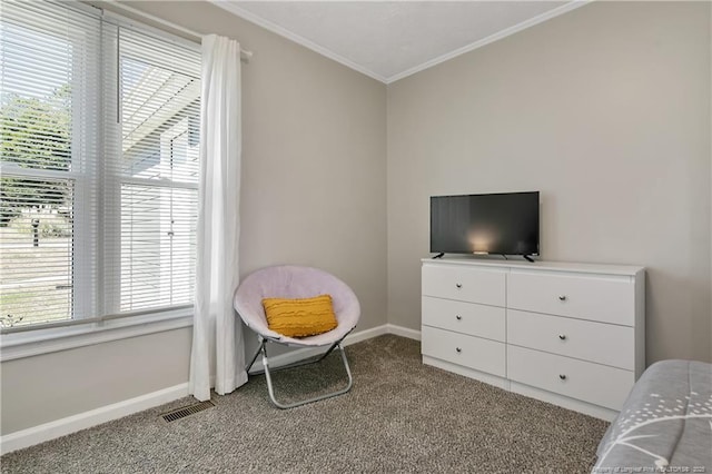 sitting room with baseboards, carpet, visible vents, and crown molding