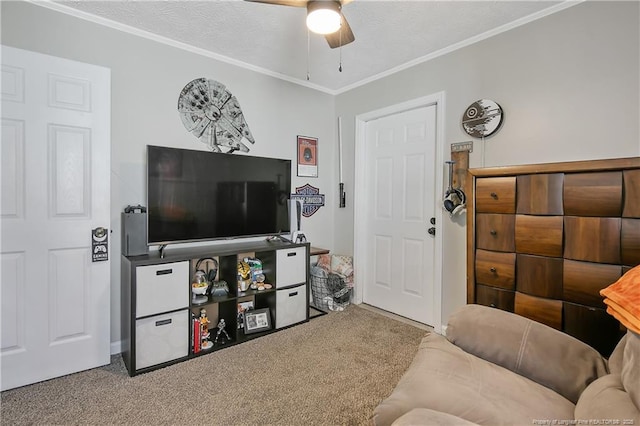 carpeted living room featuring ornamental molding, a textured ceiling, and a ceiling fan