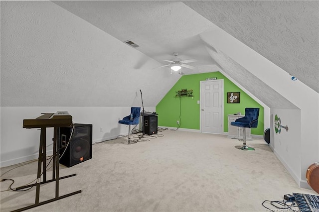 additional living space featuring carpet floors, lofted ceiling, visible vents, and baseboards