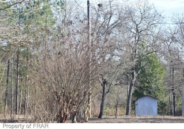 exterior space featuring a forest view