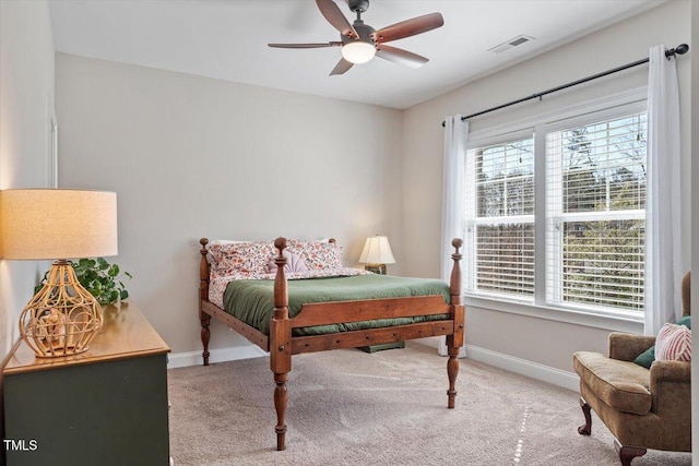 bedroom with visible vents, ceiling fan, baseboards, and carpet