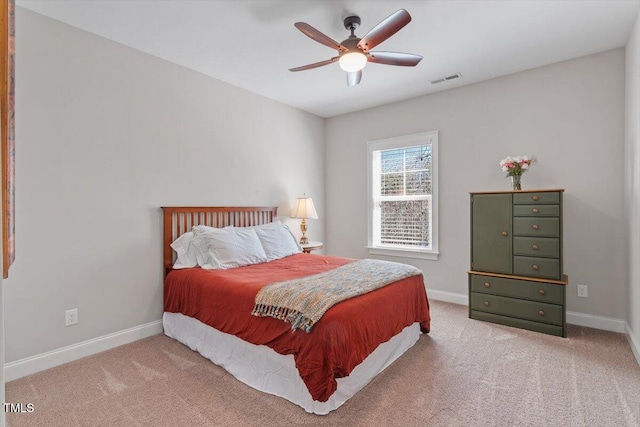 bedroom featuring visible vents, baseboards, and carpet