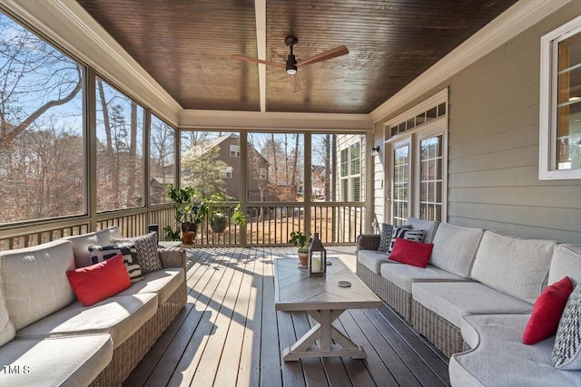 sunroom with wooden ceiling and a ceiling fan