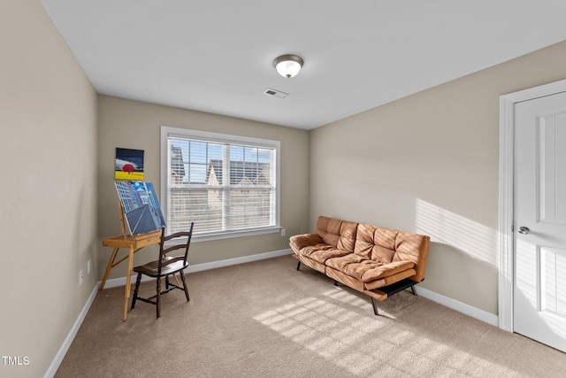 sitting room featuring visible vents, baseboards, and carpet floors