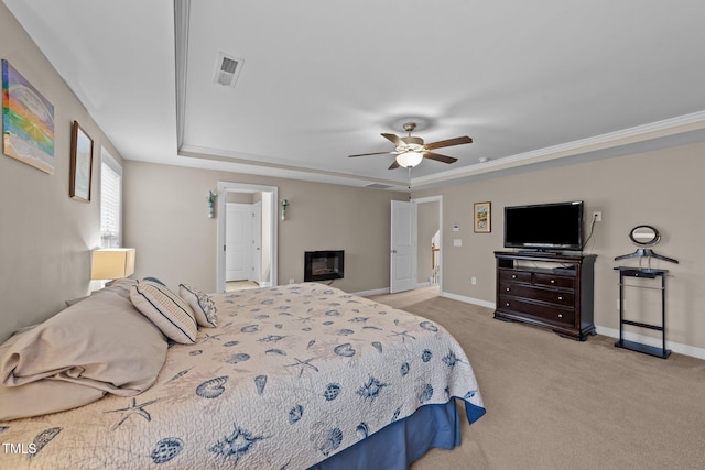 bedroom featuring visible vents, baseboards, light colored carpet, and a glass covered fireplace