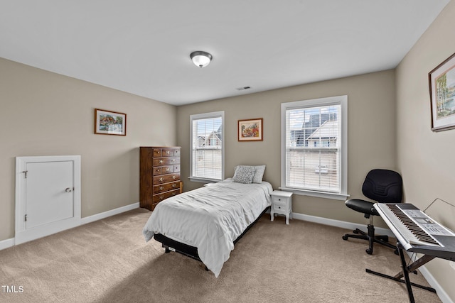 bedroom featuring carpet flooring, visible vents, and baseboards