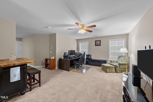 office area featuring baseboards, carpet floors, and ceiling fan