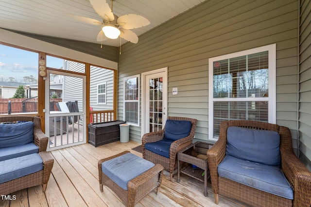 sunroom with a ceiling fan