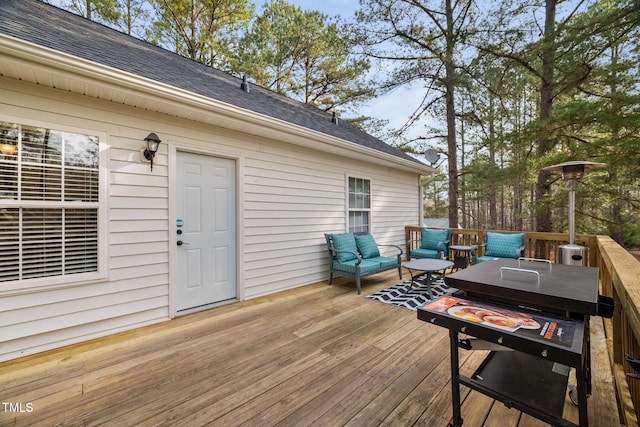 deck featuring outdoor lounge area