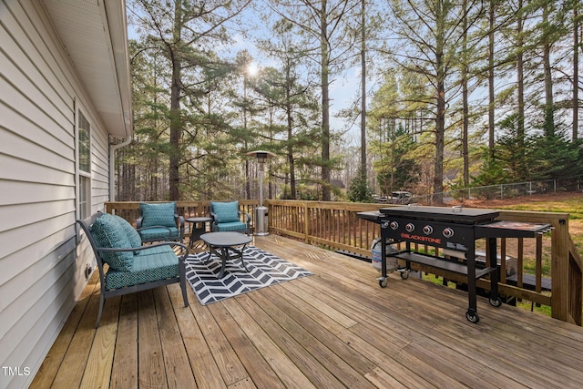 wooden terrace featuring fence