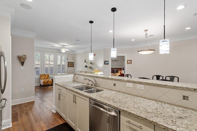 kitchen featuring stainless steel dishwasher, crown molding, ceiling fan, and a sink