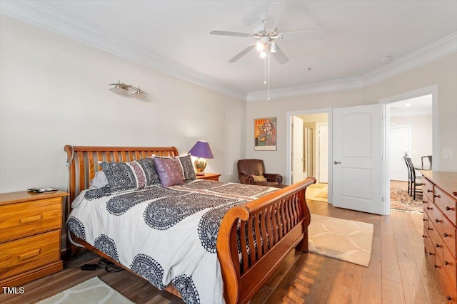 bedroom with ceiling fan, wood-type flooring, and ornamental molding