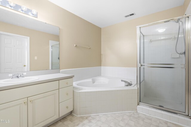 bathroom featuring visible vents, a shower stall, vanity, and a bath