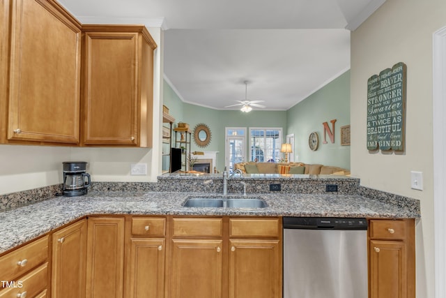 kitchen featuring ornamental molding, dishwasher, a sink, and ceiling fan