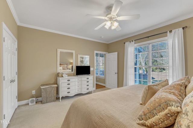 bedroom with ornamental molding, light carpet, ceiling fan, and baseboards