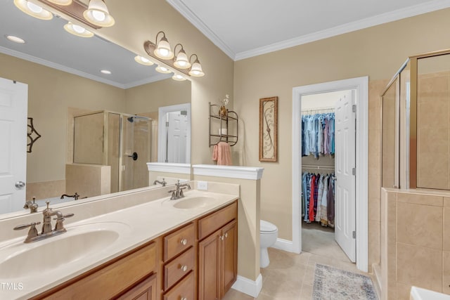 bathroom with a stall shower, crown molding, tile patterned flooring, and a sink