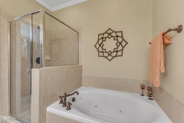 bathroom featuring a tub with jets, ornamental molding, and a shower stall