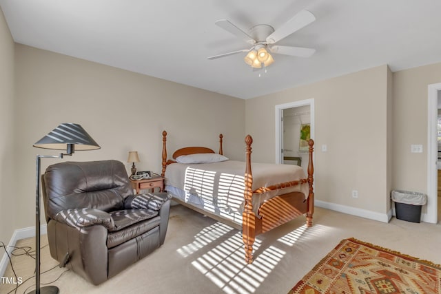 carpeted bedroom featuring a ceiling fan and baseboards