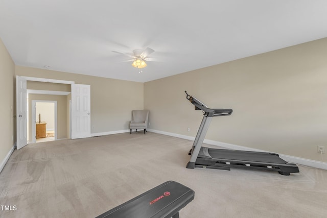 workout room featuring ceiling fan, carpet flooring, and baseboards