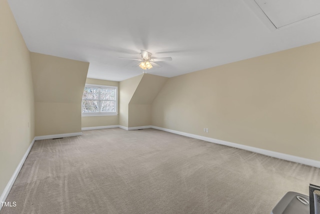 bonus room with ceiling fan, carpet floors, lofted ceiling, and baseboards