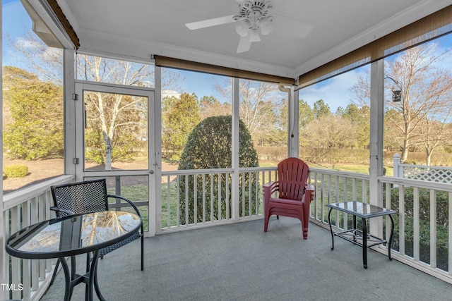 sunroom featuring ceiling fan