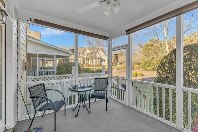 sunroom with a ceiling fan