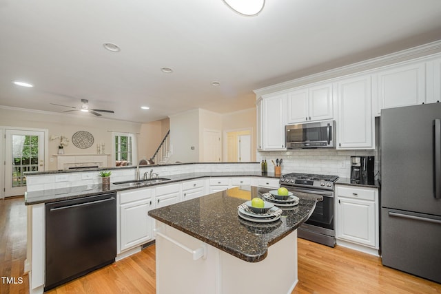 1208 Dunn Creek Xing, Wake Forest, NC 27587 - kitchen with stainless steel appliances, a sink, white cabinetry, crown molding, and recessed lighting
