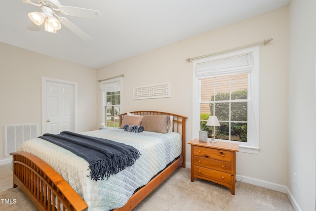 1208 Dunn Creek Xing, Wake Forest, NC 27587 - bedroom featuring light colored carpet, multiple windows, and baseboards