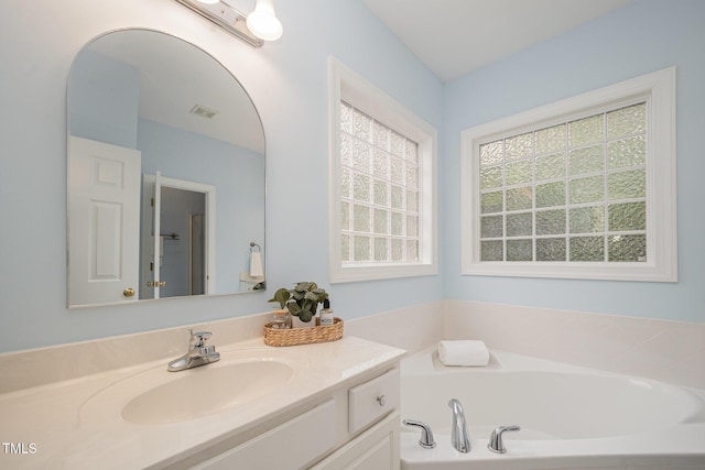 1208 Dunn Creek Xing, Wake Forest, NC 27587 - bathroom with vanity and a garden tub