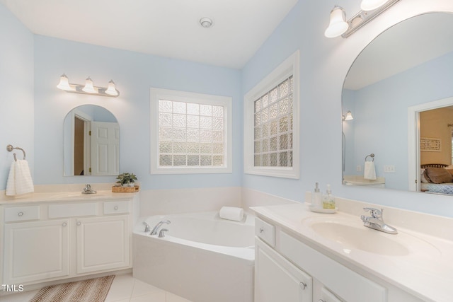 1208 Dunn Creek Xing, Wake Forest, NC 27587 - full bathroom with ensuite bathroom, two vanities, a bath, and tile patterned floors