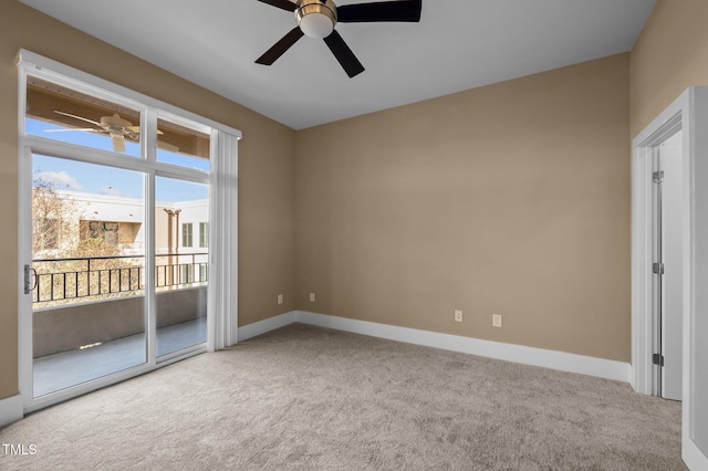 unfurnished room featuring carpet, ceiling fan, and baseboards