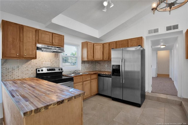 173 Style Dr, Parkton, NC 28371 - kitchen with under cabinet range hood, visible vents, wooden counters, and stainless steel appliances