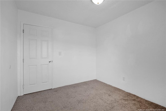 173 Style Dr, Parkton, NC 28371 - spare room featuring a textured ceiling and carpet floors