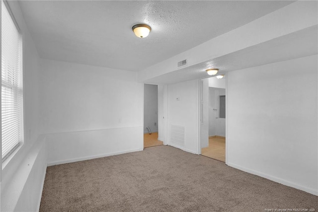 173 Style Dr, Parkton, NC 28371 - carpeted spare room with visible vents, a textured ceiling, and baseboards