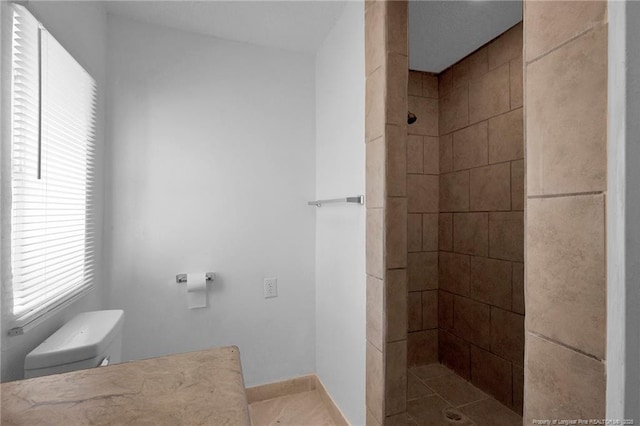 173 Style Dr, Parkton, NC 28371 - bathroom with a tile shower, toilet, and baseboards