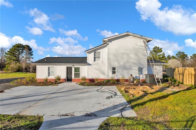 173 Style Dr, Parkton, NC 28371 - back of property with fence and metal roof